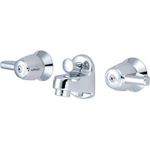 Chrome bathroom fixtures including two faucet handles and a spout.