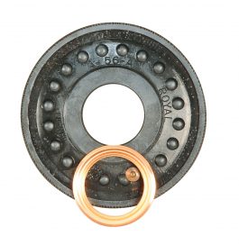 A black thrust bearing with a bronze washer, isolated on a white background.