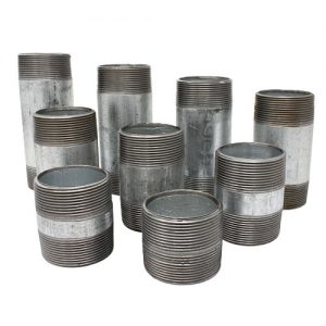 A collection of empty, stacked, silver metal tin cans on a white background.
