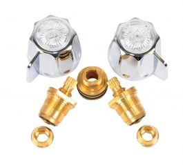 Two chrome faucet handles and brass valve parts on a white background.