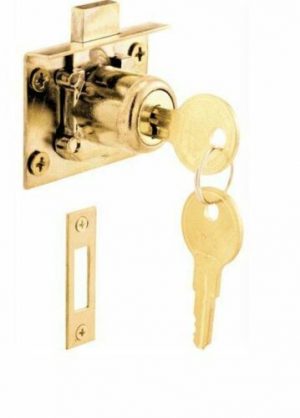 A brass bolt lock on a door with key inserted, isolated on white background.