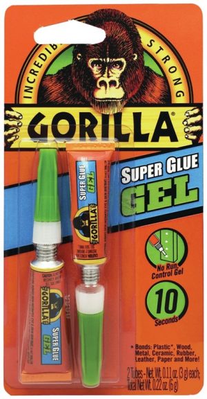 Packaging of Gorilla Super Glue Gel with two tubes on a bright orange background.