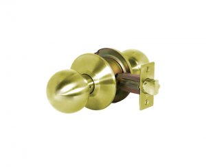 Brass door knob with lock mechanism on a white background.
