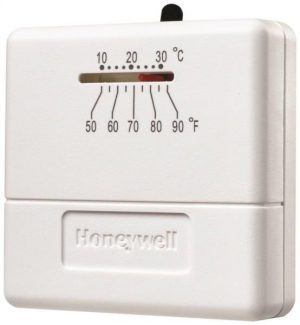 Honeywell wall-mounted thermostat showing temperature scale in Celsius and Fahrenheit.