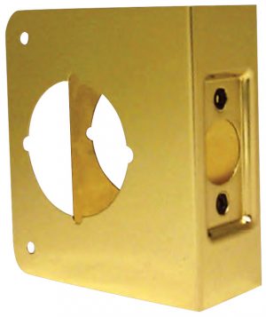 Brass doorbell chime cover removed, showing internal mechanism.