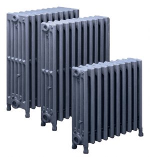 Three cast iron radiators against a plain background.