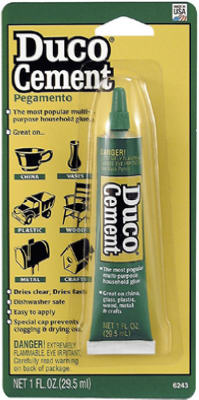 A package of Duco Cement glue on a blister card, highlighting product features and safety warnings.
