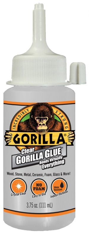 A bottle of clear Gorilla Glue adhesive for various surfaces with a gorilla image on the label.