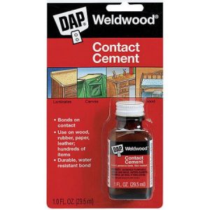 A bottle of DAP Weldwood contact cement in packaging, for bonding laminates and canvas.