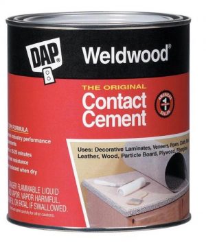 Can of Weldwood contact cement with usage instructions and warnings on the label.