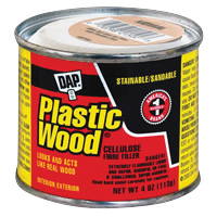 A can of DAP Plastic Wood filler for repairs with a red and black label.