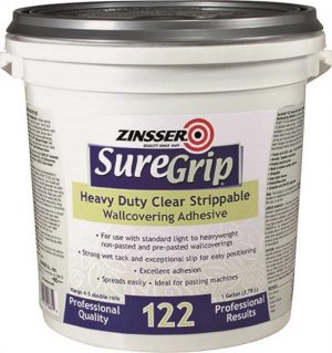 A bucket of Zinsser SureGrip Heavy Duty Clear Strippable Wallpaper Adhesive.