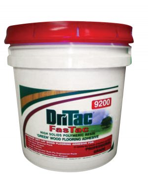 A white and red container of DrTac FastTac high solids polymeric resin green wood flooring adhesive.