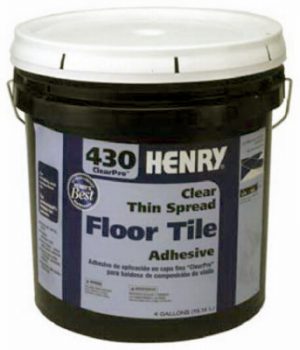 A bucket of Henry 430 ClearPro floor tile adhesive on a white background.