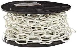 A spool of white plastic chain on a black reel.