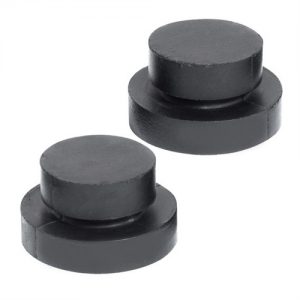 Two black magnetic board game pieces on a white background.
