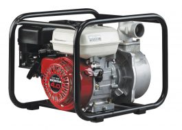 Portable red and black Honda generator with metal frame on a white background.