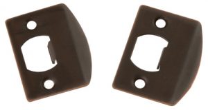 Two brown plastic light switch plates on a white background.