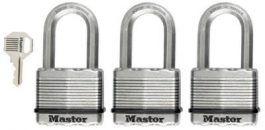 Three silver padlocks in a row with a key on the left side.