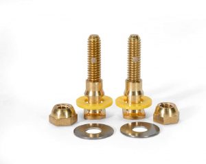 Three brass bolts with matching nuts and washers on a white background.