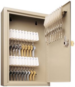 Key storage cabinet with numbered and labeled hooks, holding various keys.
