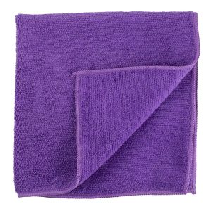 Folded purple bath towel isolated on white background.