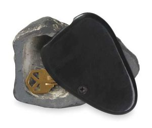 A black kneepad with a metallic gold key displayed on white background.