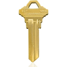 A single brass key with distinct grooves and "SC1" stamp against a white background.