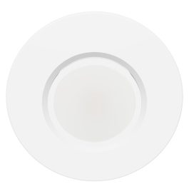 An overhead view of a simple, empty white plate on a white background.