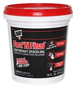 A container of DAP Fast'N Final lightweight spackling for patching walls.