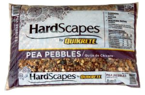 A sealed bag of Quikrete HardScapes Pea Pebbles for gardening and landscaping.