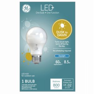 Packaging of an LED+ dusk to dawn light bulb with details on energy efficiency and cost.