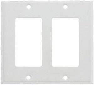 Double-gang white wall plate for electrical switches or outlets on a white background.