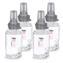 Four bottles of Gojo hand sanitizer with pump dispensers on a white background.