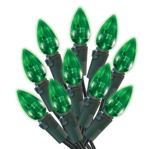 A bundle of green Christmas lights with a white background.