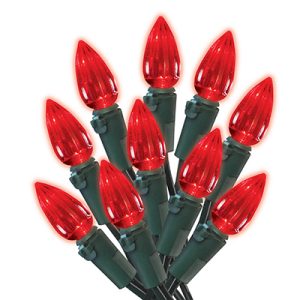 A bundle of red Christmas lights with a green wire on a white background.
