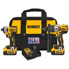 A set of DEWALT power tools including a drill, batteries, charger, and carrying bag.