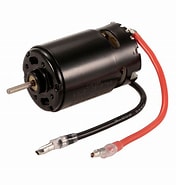 Small electric motor with red and black wires on a white background.