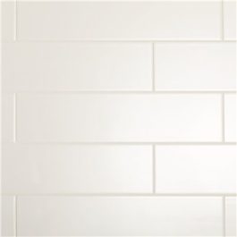 White subway tiles arranged horizontally on a wall.
