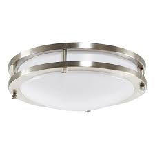 Flush mount ceiling light fixture with a frosted glass shade and metallic trim.