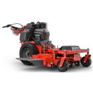 Red and black commercial zero-turn lawn mower isolated on white background.