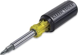 A black and yellow screwdriver with a clear handle and the brand name on it.