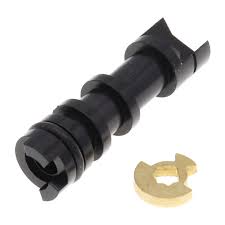 A black AR-15 rifle muzzle brake with a small gold colored crush washer.